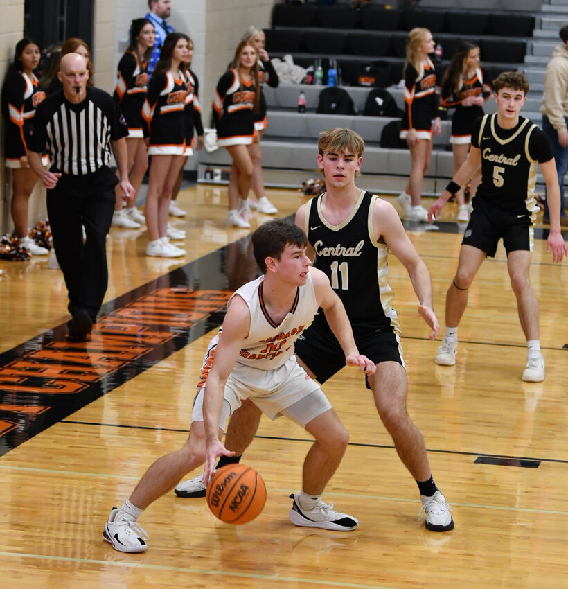 Henry Stone (10) backs down Carter Sage (11). Stone finished with 9 points in Monday's blowout win over the Tigers.