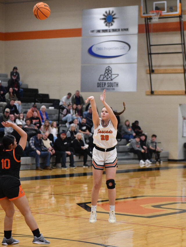 Jade Tolar (20) connects on one of her three three-pointers in Friday's win. Tolar finished with 11 points.