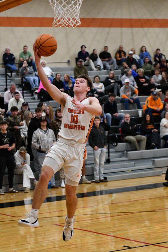 Henry Stone (10) lays in two of his game-high 18 points in Tuesday's win over the Huntland Hornets.