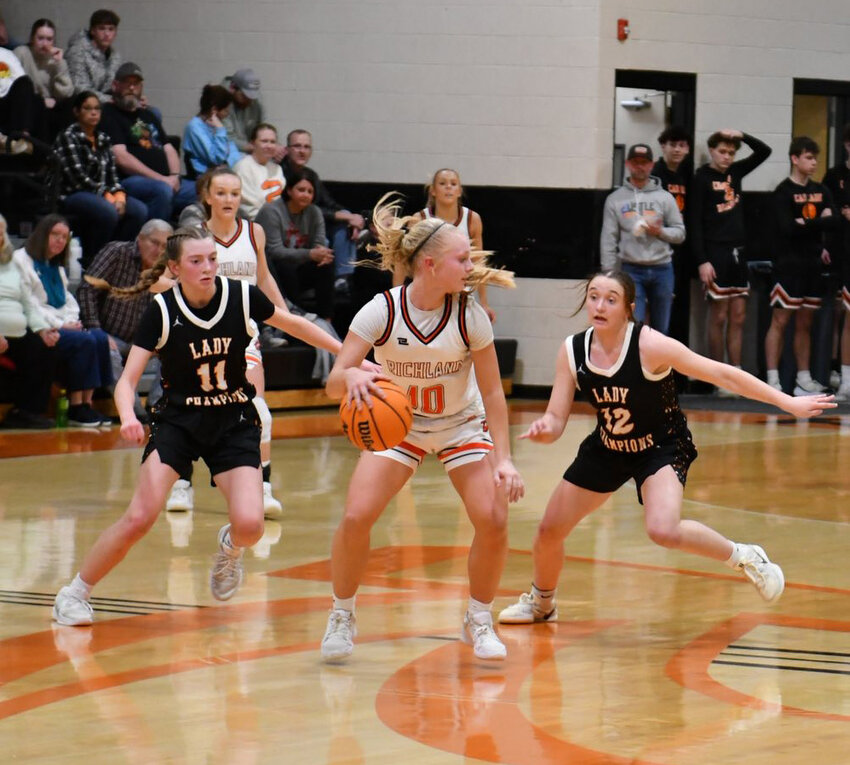Lizzie Keele (11) and Lexi Comstock (12) look to double-team Richland's Bailey Blair (10) in Saturday's non-district loss. Blair finished with a game-high 27 points for the Lady Raiders.