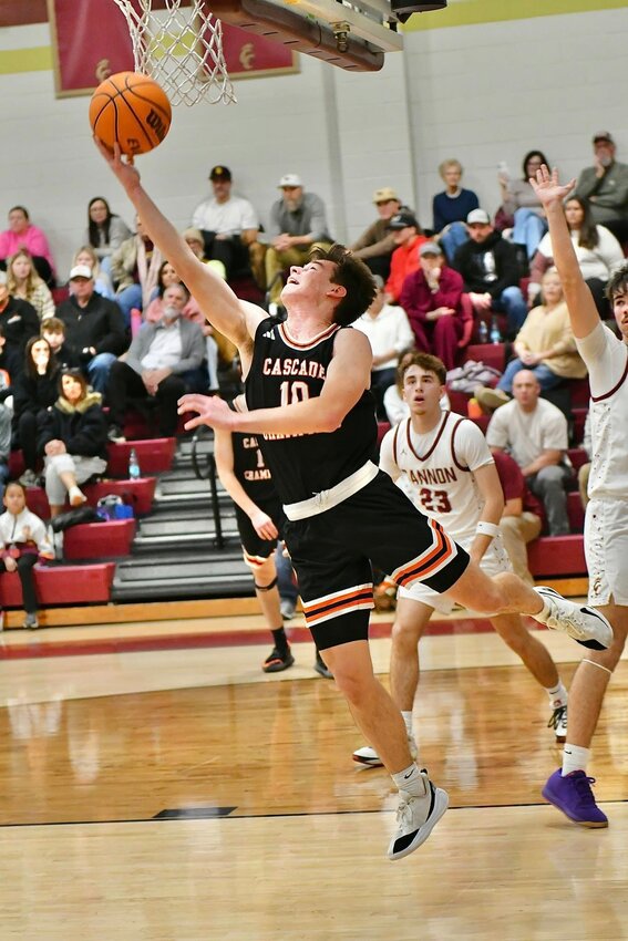 Henry Stone (10) reverses in two of his 19 points in the second half of the Champions' upset win over No. 3 Cannon County on Tuesday night.