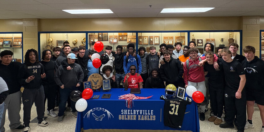 Bailey (center) surrounded by classmates and teammates after signing with Austin Peay on Wednesday.
