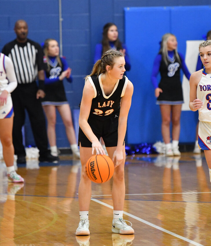 Cascade's Kaegan Young (22) resets the offense in the fourth quarter of Friday's win over the Lady Rockets. Young finished with a tough 12 points, including eight in the second half, to go along with three steals.