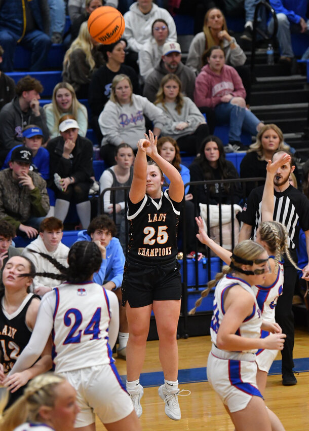 Cascade's Jocelyn Laughlin (25) knocks down the first of her two made triples in Friday's win at Chapel Hill. Laughlin finished with 12 points, four rebounds, four assists, and two steals.