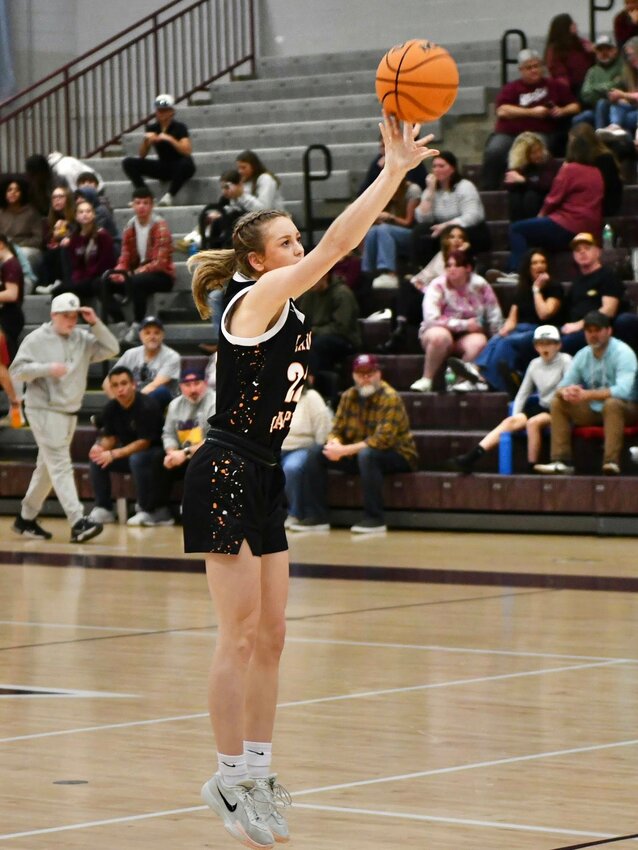 Cascade's Kaegan Young (22) fires away from downtown in Tuesday's trip to Eagleville. Young finished with 14 points in the non-district win.