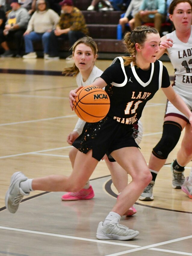 Cascade's Lizzie Keele (11) drives to the basket at Eagleville. Keele knocked down a couple of threes as part of a 12-point outing in Tuesday's road win.