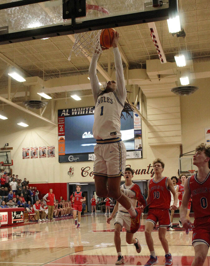Shelbyville's Jordan Taylor (1) goes up for a huge fourth quarter slam in Tuesday's loss to the Falcons. Taylor finished with 10 points on the night.