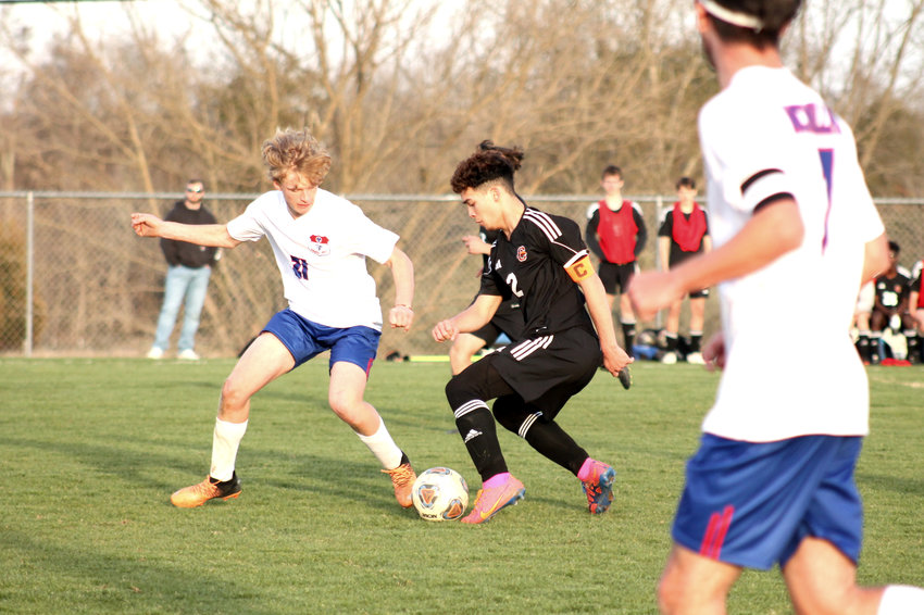 Ivan Draine navigates through the Rockets' defense in their matchup on Monday night in Forrest's 3-0 victory over Cascade.