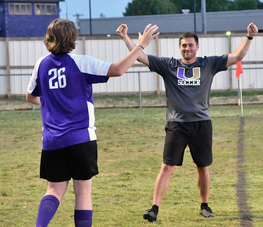 Coach Jesse Cooper of the Vikings celebrates with Coy Rogers following the Viking win.