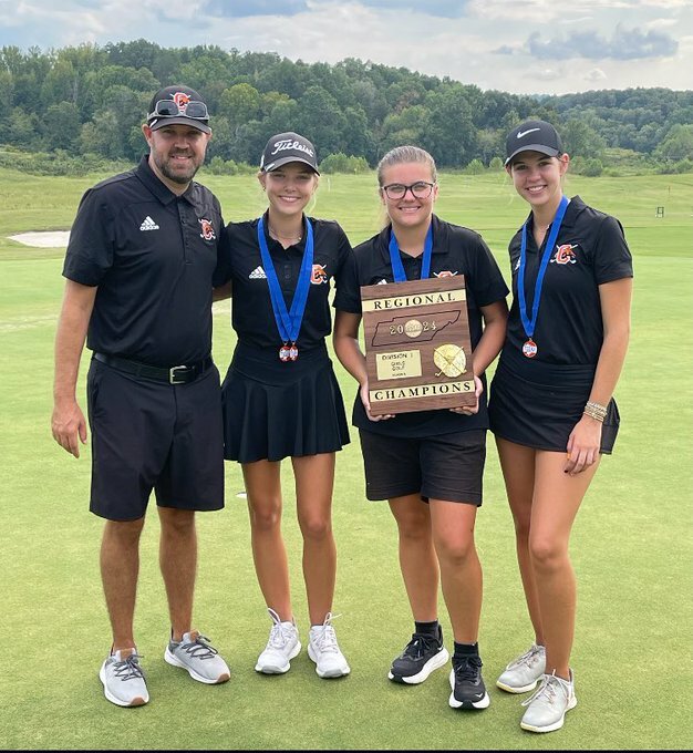 (From left to right) Coach Jeremy Bankston, Anna Clanton, Tatyana Greene, and Sara Kate Hall after winning first place as a team in the Regional competition.