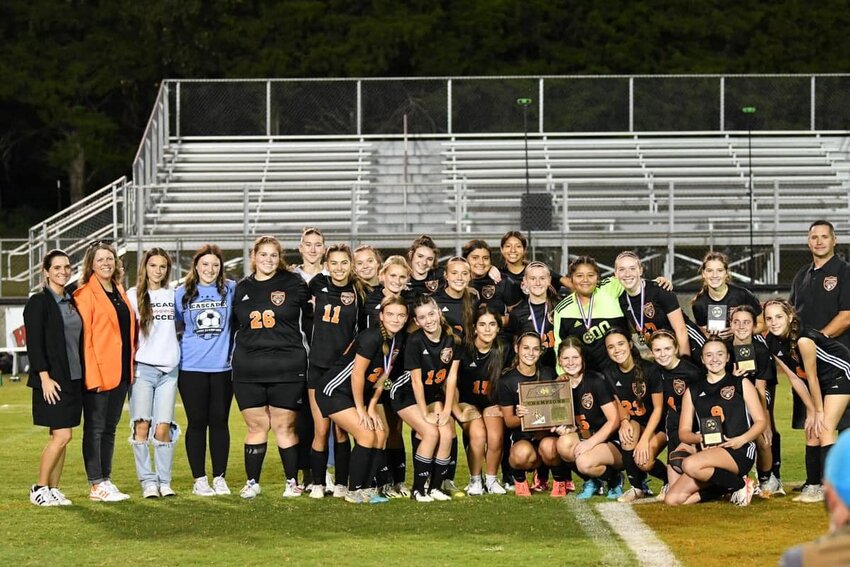 The Cascade Lady Champions after defeating the Huntland Hornets to win the District 9-A title.