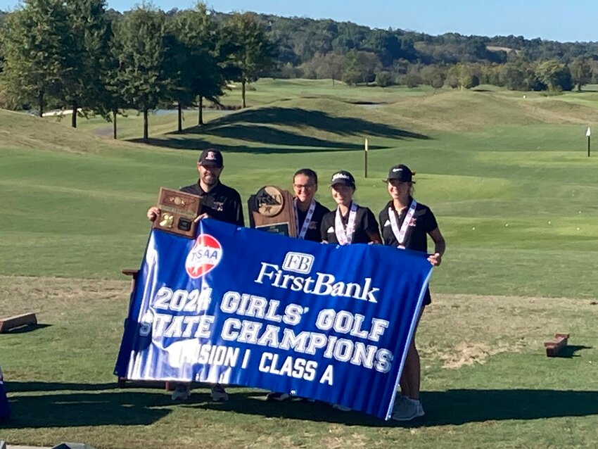 (from left to right) Coach Bankston, Tatyana Greene, Anna Clanton, and Sara Hall pictured after winning the program's first every state championship on Tuesday.