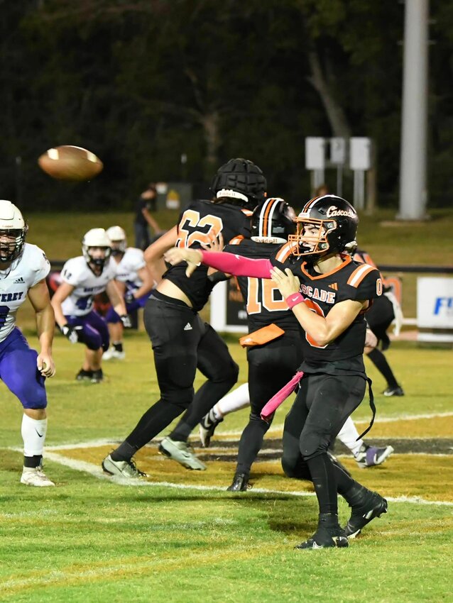 Braxton Burris (0), pictured here throwing against Monterey, eclipsed the 200-yard mark through the air at Cannon County in Friday's loss in what was only his third start under center in his career.