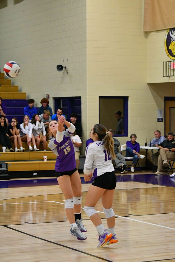 Hadley Martin (15) returns a serve while Breanna Grooms (18) looks on. Martin contributed with 3 kills against Cumberland County while Grooms tallied a team-high 17 digs.