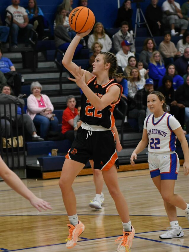 Kaegan Young (22) puts up a floater in the second half at Huntland. Young scored a game-high 16 points in Thursday's win.
