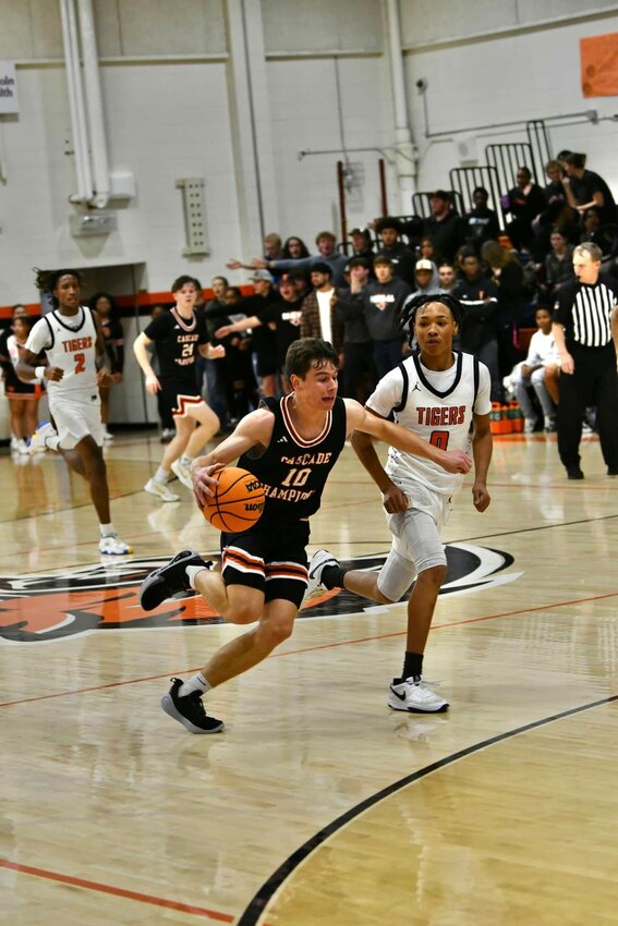Henry Stone drives to the basket for two of his seven points in Friday night's win at Fayetteville City.