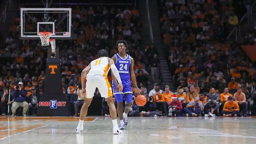 Camryn Weston (24) guarded by Jordan Gainey (11) during his game-high 24-point night in Knoxville on Monday.