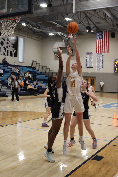 Alyssa White (11) puts up two of her eight points against Battle Creek in the Viqueens' win on Saturday at the Moore County Classic.