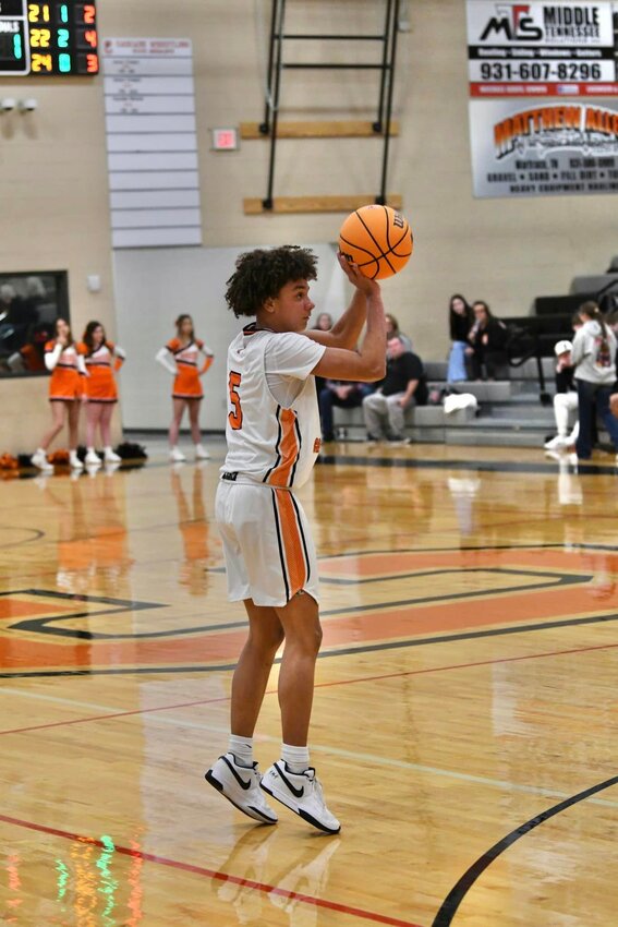 Kaleb Kelso (5) fires away from downtown in Friday's big win against Central Magnet. He led the way with a game-high 24 points, shooting 10/11 from the field overall to go with 4/4 shooting from downtown.