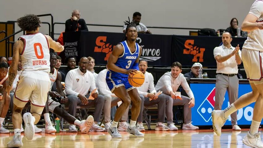 Jestin Porter (3) fires away from downtown in MTSU's two-point win at Sam Houston State. He finished with a game-high 28 points, shooting 8-12 from outside.