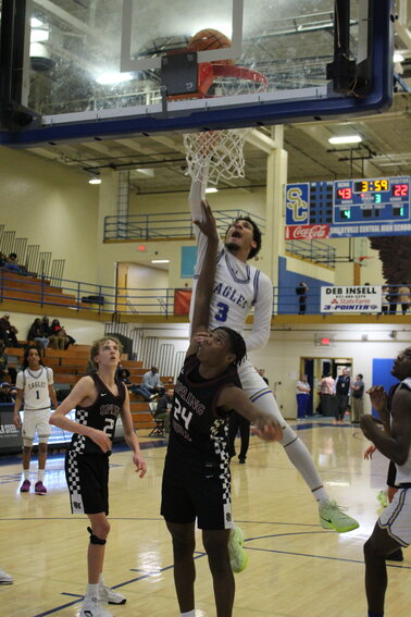 Tae'Shawn Shelton (3) skies for two of his team-high 16 points during the third quarter in Shelbyville's 37-point win over Spring Hill on Friday night.