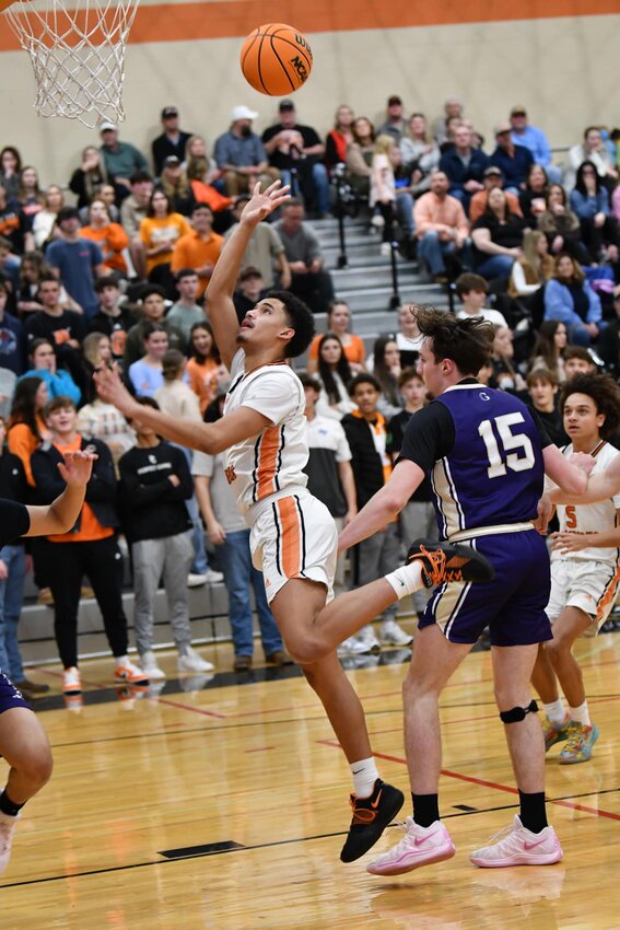 Jason Cullum (3) floats in two of his team-high 17 points in Cascade's blowout District 9-AA win on Homecoming against Grundy County at The Stable on Friday night. Cullum finished with 17 points, seven assists, and five rebounds in a strong all-around performance.