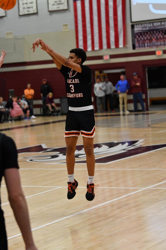 Jason Cullum (3) fires away from downtown at #1 Eagleville. He scored a game-high 17 points, but was the only Champion to score in double-figures in the loss.