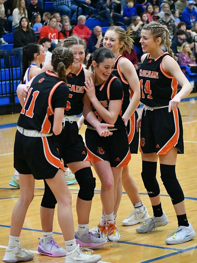 Sophie Ray (5) celebrates with her teammates after she scored her 1,000th career point against Chapel Hill on Friday. Ray finished with 12 points and six rebounds, including four on the offensive end.