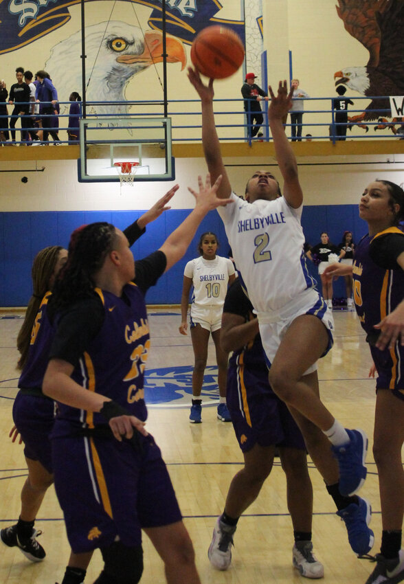 Janiya Leslie (2) barrels into the lane for two of her game-high 22 points against Columbia Central on Thursday.