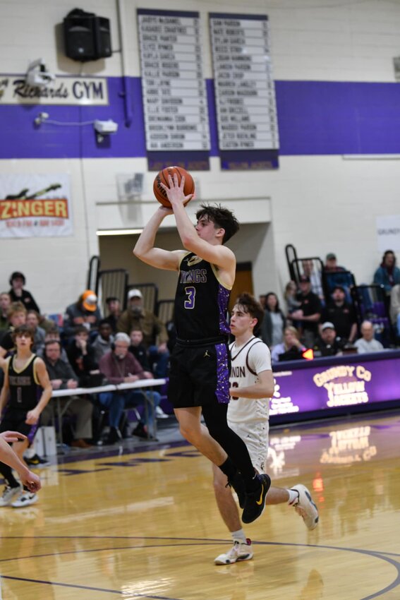 Charlie Haskins (3) floats through the lane for two of his 12 points against Cannon County on Friday night.