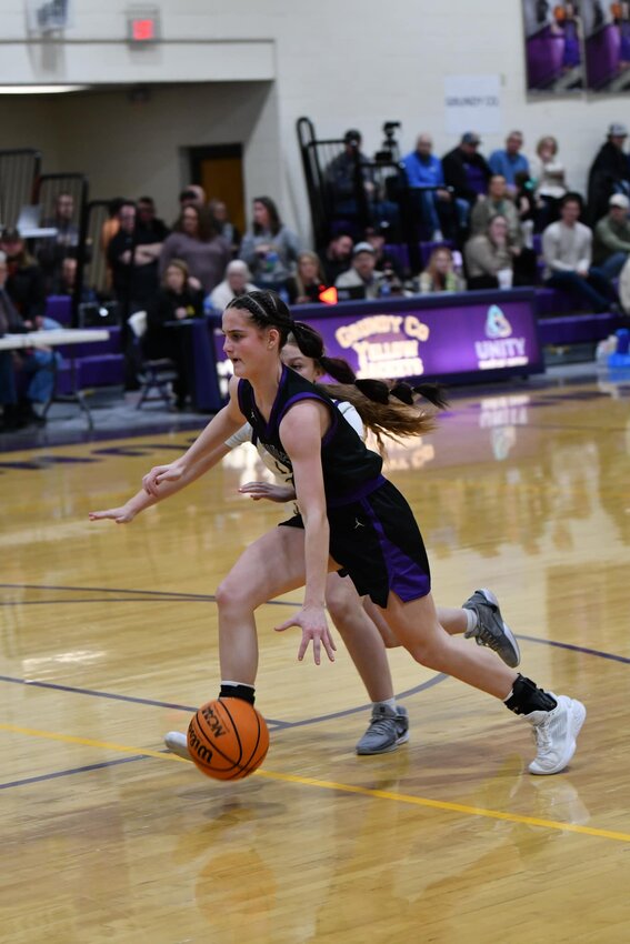 Anna Haskins (3) attacks the basket against Grundy County during Saturday's District 9-AA 3rd-Place game. She scored a team-high 19 points in the Viqueen's 55-54 win to secure third-place in the district.