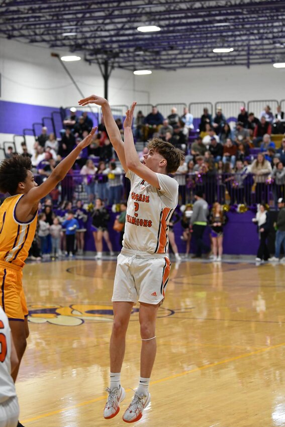 Noah Watson (2) fires the go-ahead three-pointer in OT vs Community. He finished with 10 points on the night.