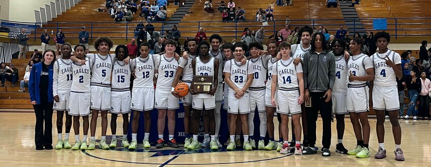 The 2024-25 District 9-AAAA Champions, Shelbyville Central Golden Eagles, after taking down Lincoln County, 60-56, inside of Rick Insell Gymnasium on Tuesday night. Jevon Lee (30) led all scorers with 20 points, including the go-ahead three-point play with 38 seconds left in the game.