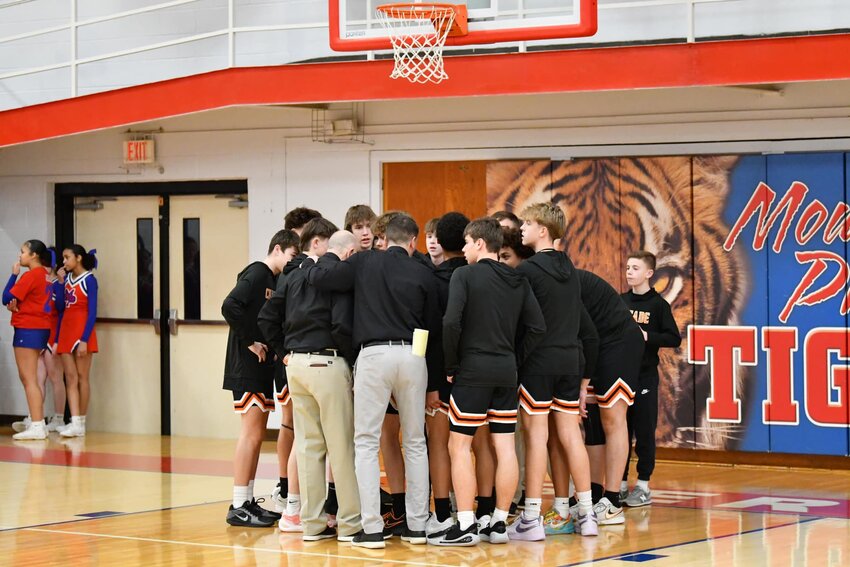 Cascade huddles before their Region 5-AA Quarterfinal matchup against Mt. Pleasant in a rematch of the February 13th matchup that saw the Tigers come away with a 59-48 win at The Stable.