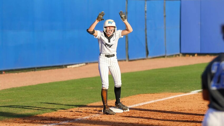 Macie Harter (5) celebrates at third base after a 2-RBI triple into centerfield in the top of the fourth inning against Memphis.