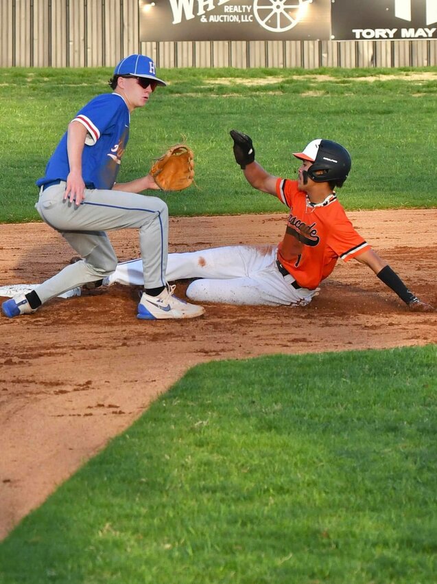 Jordan Childress (1) swipes second base against Huntland. Childress was hit by a pitch and worked a walk, coming around to score both times while also tallying one RBI despite not recording a base hit.