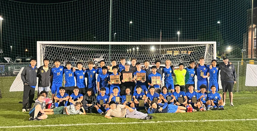 Shelbyville Central won its fourth-consecutive District Championship under Head Coach Chris Fritz (far right) after a dramatic 2-1 win against Columbia Central on Thursday.
