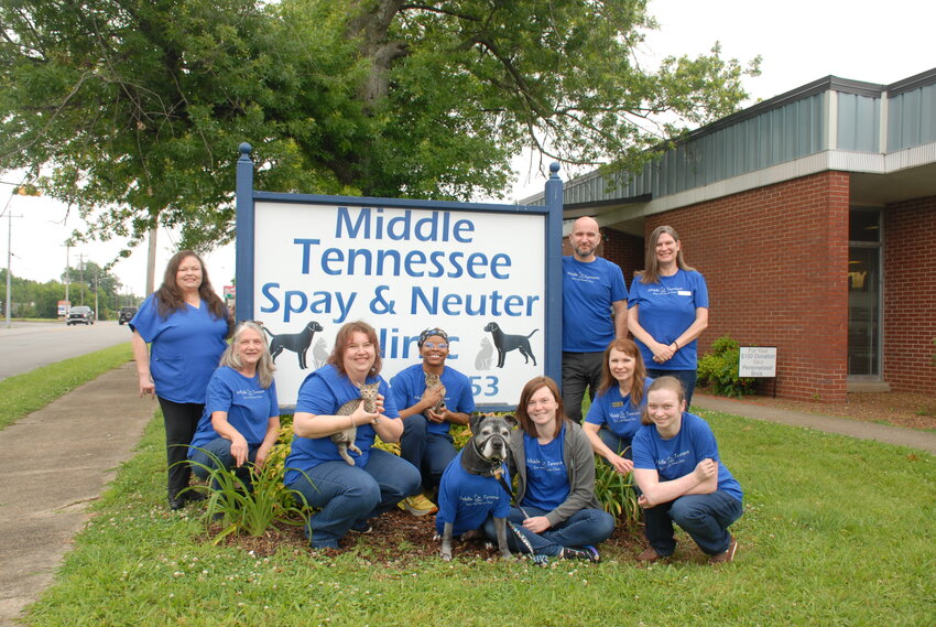 Celebrating together the 15th anniversary, with fur friends, from left, back row, Sherri Frame, Tim Zwarton, Stephanie Davis, front row, from left: Kathy Carothers, Amber Cates, Dr. Alexandria Logan, Krueger, Katharine Frengel, Kimberly Warren, and Alayna Tant. The cats are from A Nutter Cat Rescue.