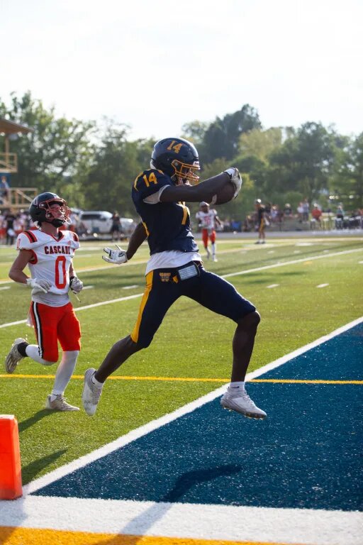 Joel Wyatt (14) strolls into the end zone in a preseason scrimmage before the 2024 campaign against Cascade while at The Webb School