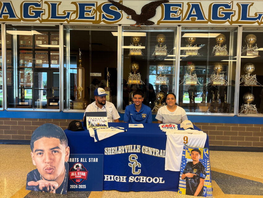 Emmanuel Leyva (middle) after signing with Lincoln Memorial University last Monday with his parents at his side for the special occasion.