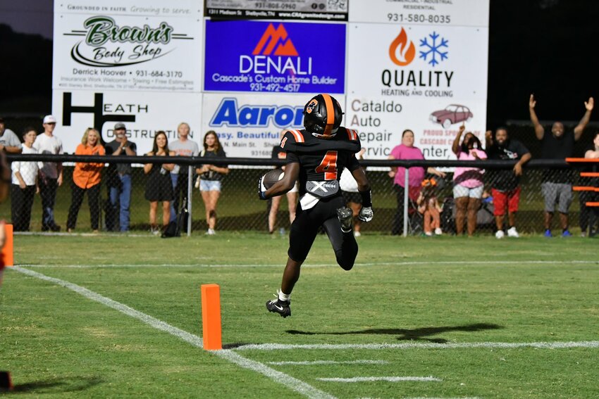 Corey Gooch (4) sprints into the end zone for his second of three TDs on Friday. He finished with 35 yards rushing and 65 yards receiving.