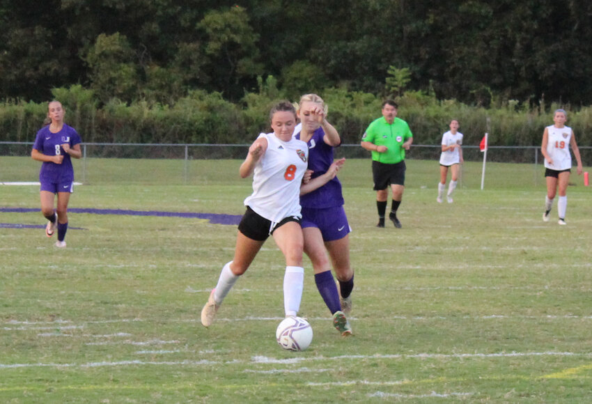 Lexi Comstock (8) powers her way to the edge of the box before firing home her first goal of the game to put Cascade up 3-0 in the 34th minute. Comstock added two more goals in the second half to complete the hat trick in the Lady Champs' 5-0 win.
