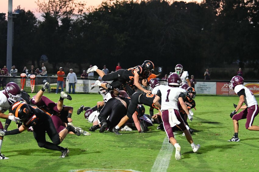 Nate Zimmerman (20) finished with 97 yards rushing and 2 TDs in the win on Thursday against Eagleville.