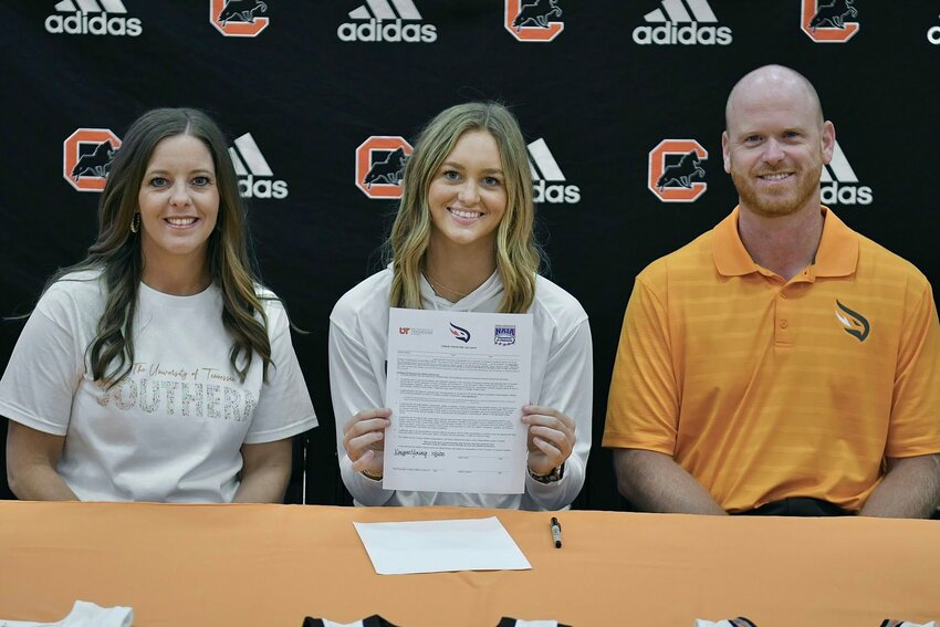 Kaegan Young (center) signed with UT Southern on Monday to continue her basketball career at the next level. She joins the Firehawks' 2026 signing class.