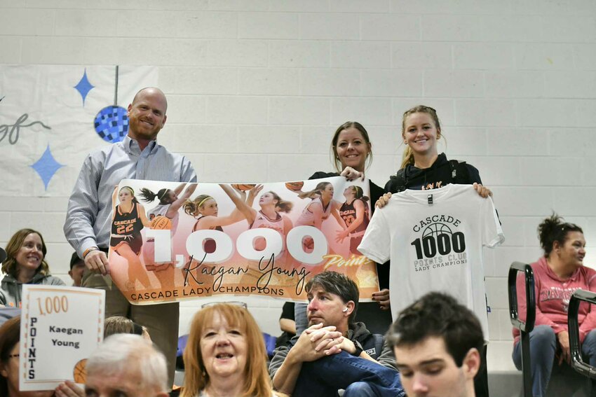 Kaegan Young (right) after scoring 1,000 career points at Franklin County.