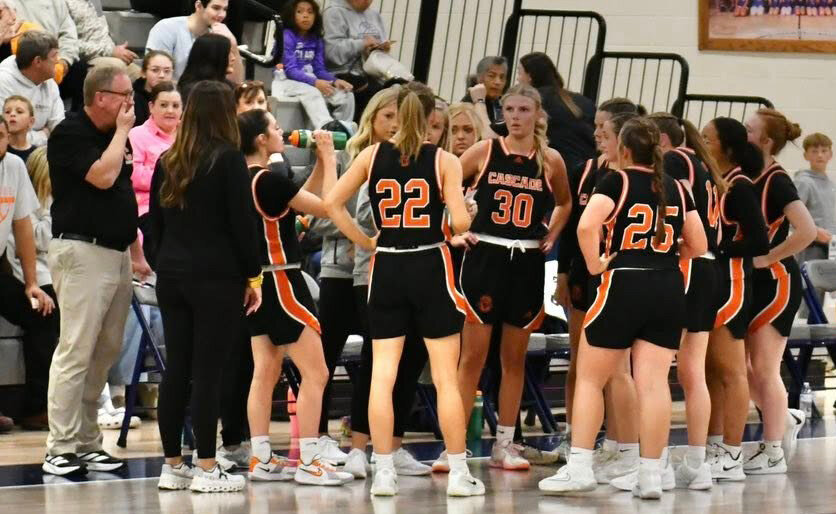 The Cascade Lady Champions huddle against Franklin County in the 2025 HOF season opener at Franklin County on November 18, 2025.