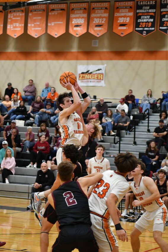Cooper McElroy hangs and connects through the contact for two of his team-high 12 points in Friday's loss.