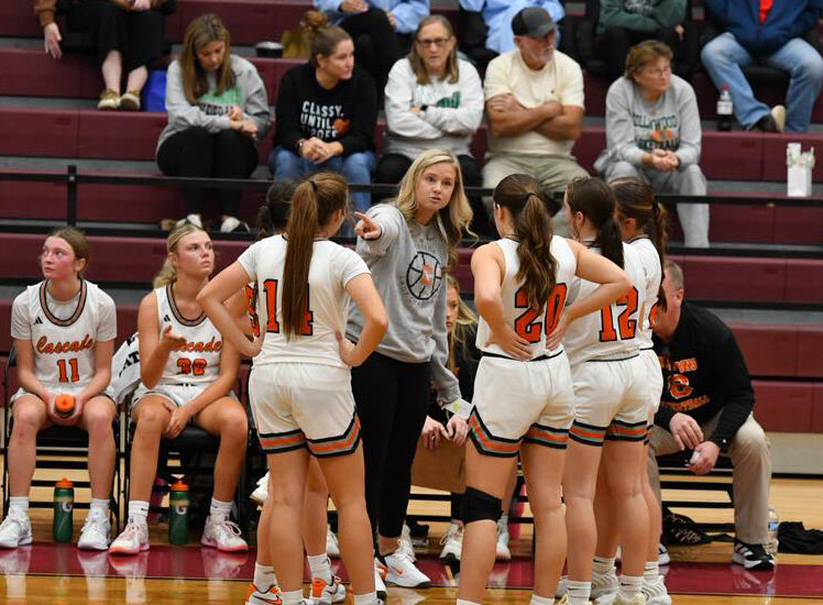Lady Champions' Head Coach Janie Demonbreum (center) gives her team instructions during a timeout in the 31-point win over Collinwood on Monday.