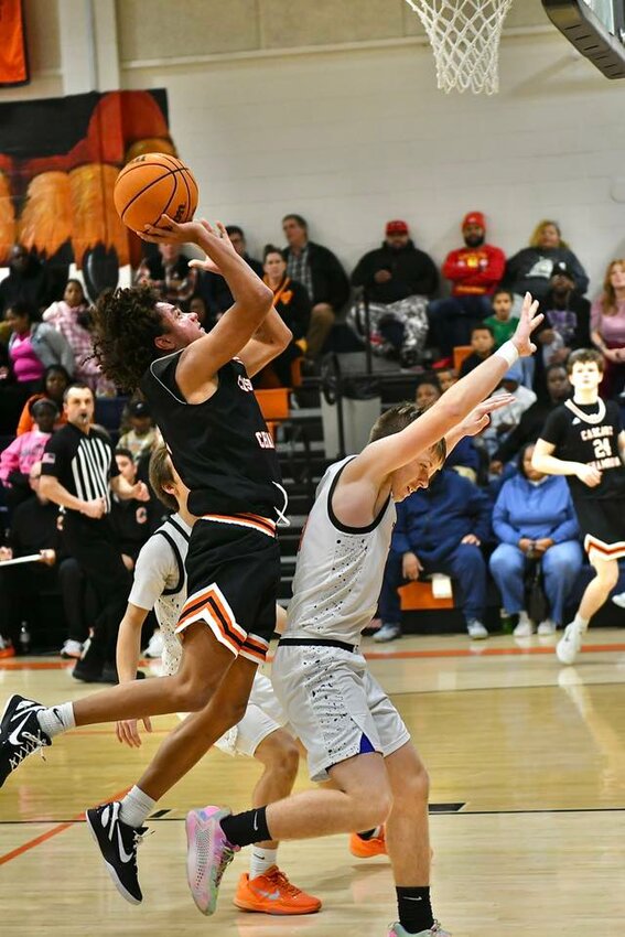 Kaleb Kelso (5) puts in 2 of his career-high 28 points in Friday's win at Fayetteville City. He finished with six rebounds and five steals, and went 9/12 at the FT line in the process.
