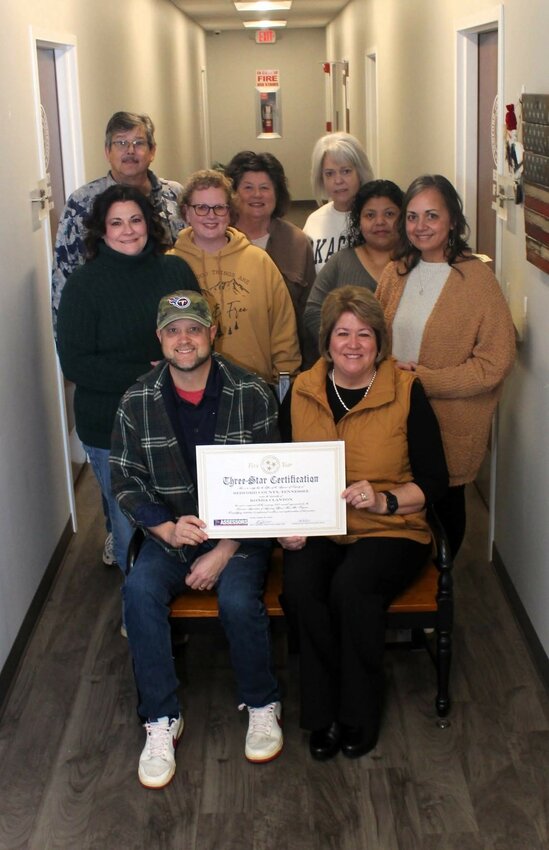 Bedford County Property Assessor Ronda Clanton shares the Three-Star certification recently received with her entire staff.